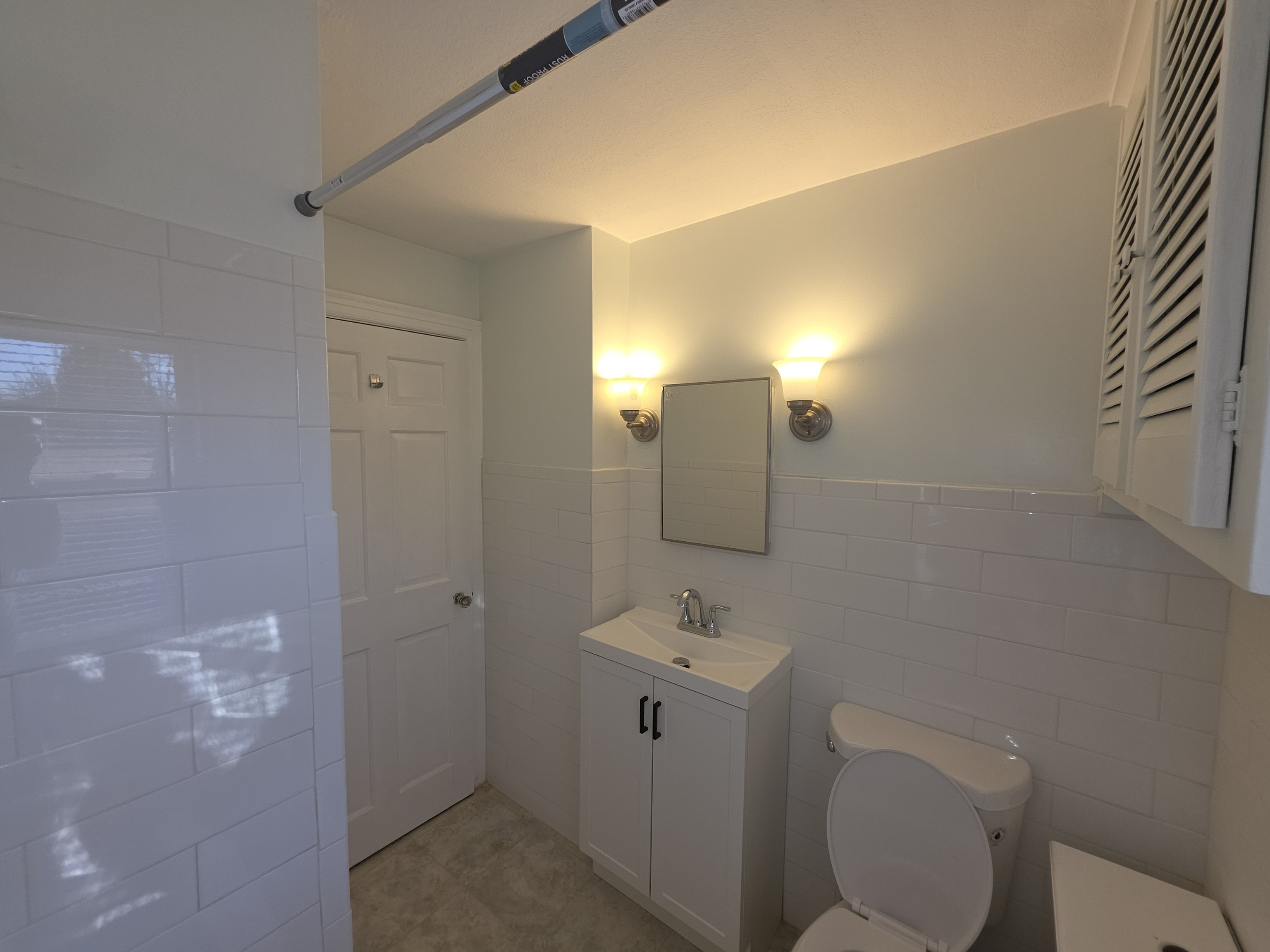 15 Keller Avenue Enfield, CT 06082 - Photo 8 of 13 a bathroom with a toilet sink and mirror