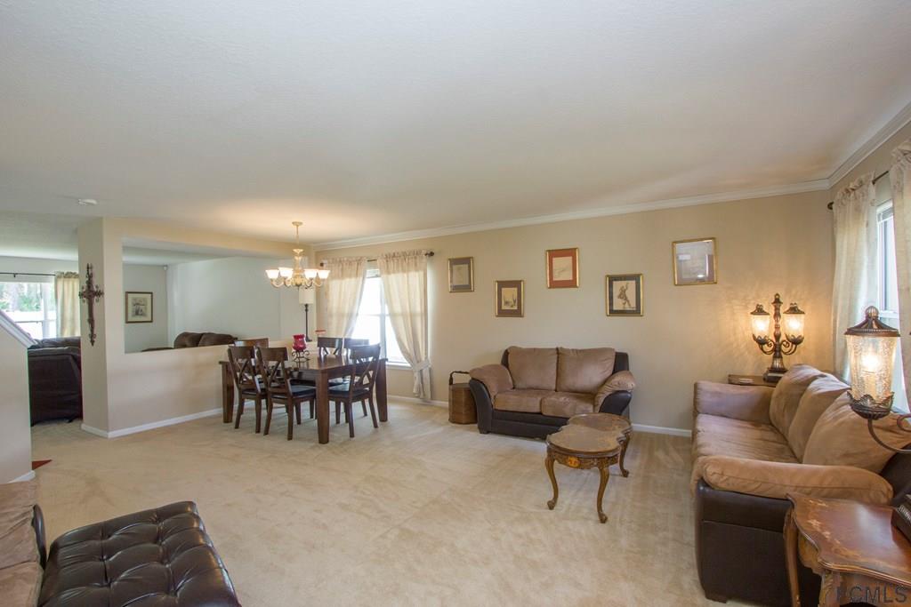 3 Riddle Place Palm Coast, FL 32164 - Photo 2 of 47 a dining room with furniture and window