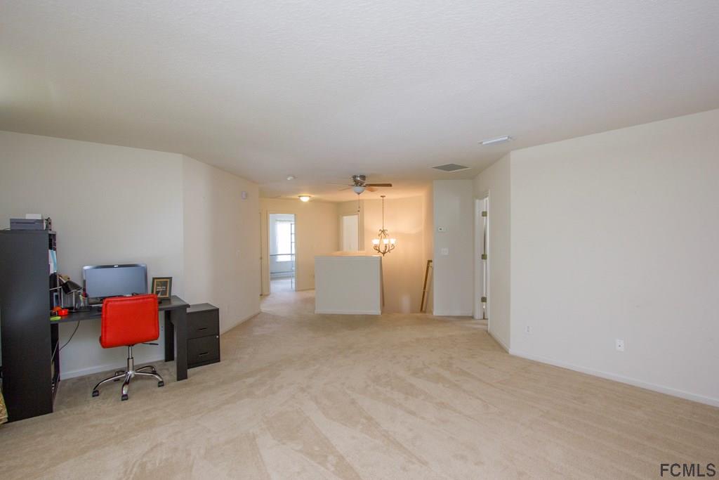 3 Riddle Place Palm Coast, FL 32164 - Photo 17 of 47 a view of a workspace with furniture and a window