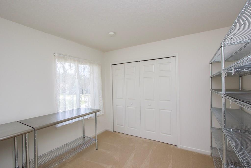 3 Riddle Place Palm Coast, FL 32164 - Photo 26 of 47 a view of an empty room with a window