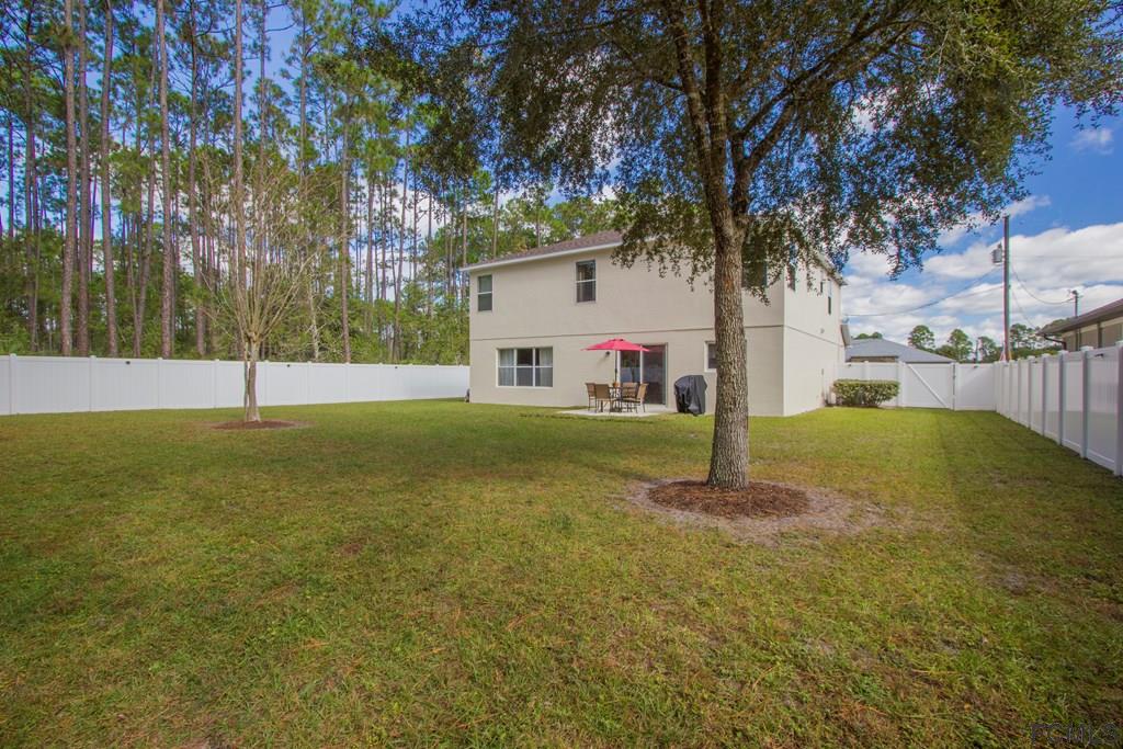3 Riddle Place Palm Coast, FL 32164 - Photo 41 of 47 a view of a house with a back yard