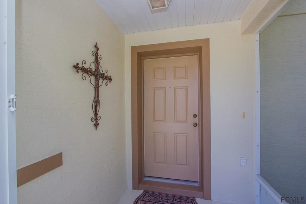 3 Riddle Place Palm Coast, FL 32164 - Photo 45 of 47 a view of a hallway with a door