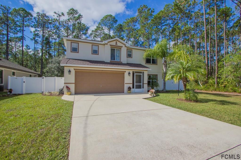3 Riddle Place Palm Coast, FL 32164 - Photo 46 of 47 front view of house with a yard