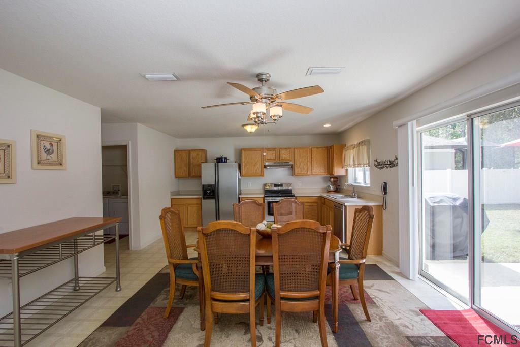 3 Riddle Place Palm Coast, FL 32164 - Photo 10 of 47 a dining room with furniture and window