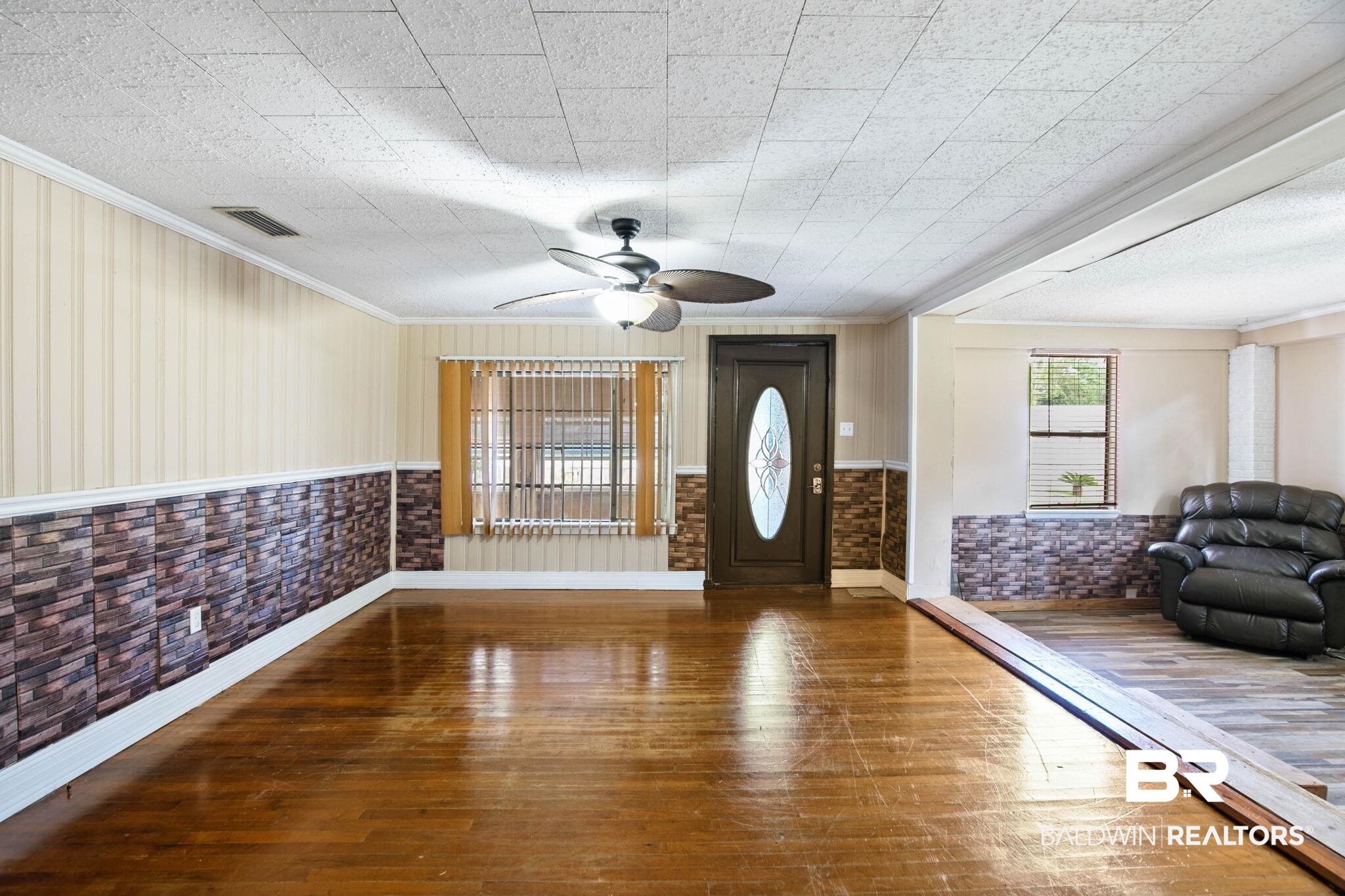 23240 County Road 47 Perdido, AL 36562 - Photo 6 of 29 Entryway with dark wood-style flooring, ornamental molding, a ceiling fan, and wainscoting