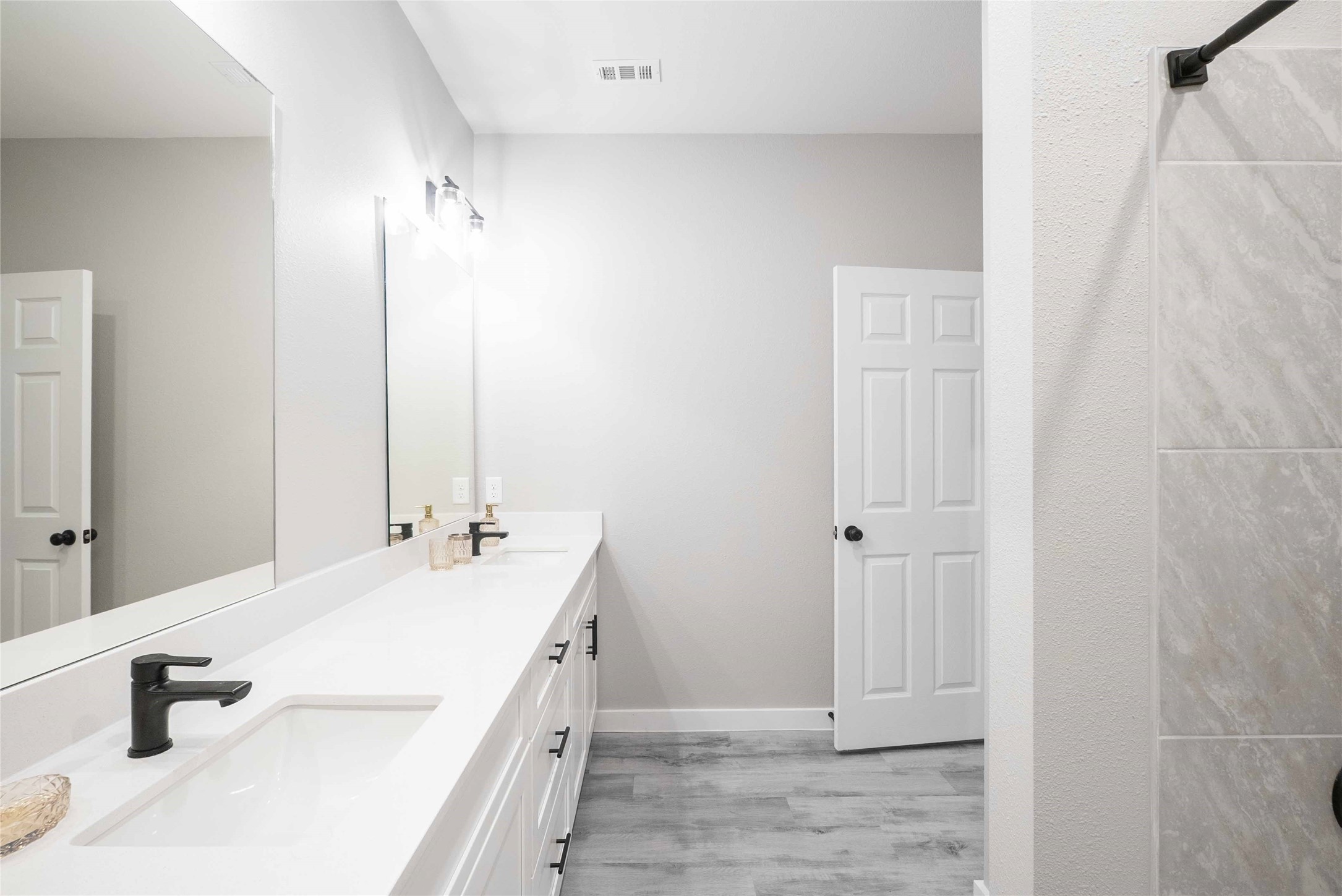 2101 Reinke Road, Unit 3312 Waller, TX 77484 - Photo 11 of 24 a bathroom with a double vanity sink and a mirror