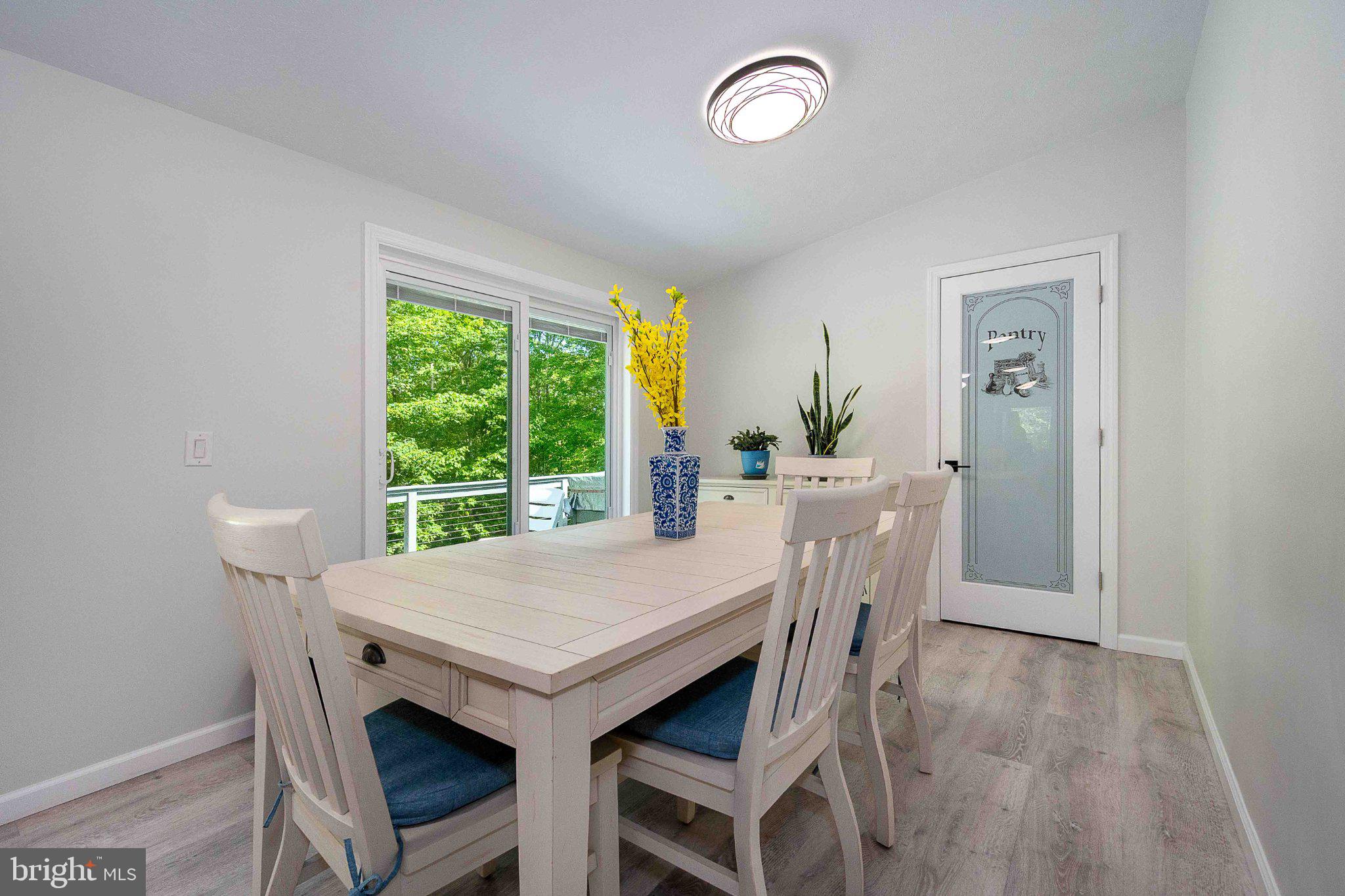 511 Hill Top Road Oakland, MD 21550 - Photo 19 of 51 Bright dining space with nature views.