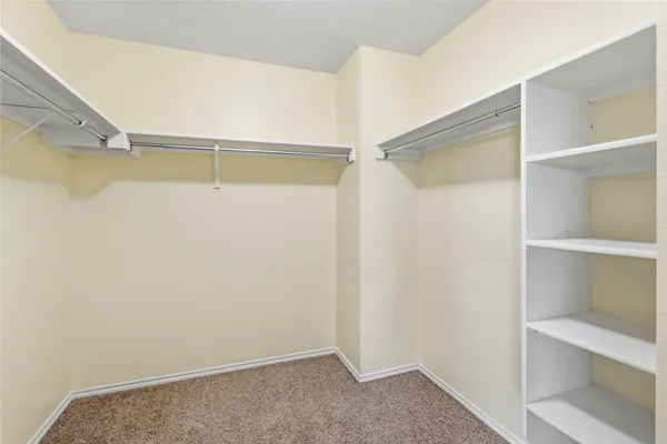 a view of an empty walk in closet