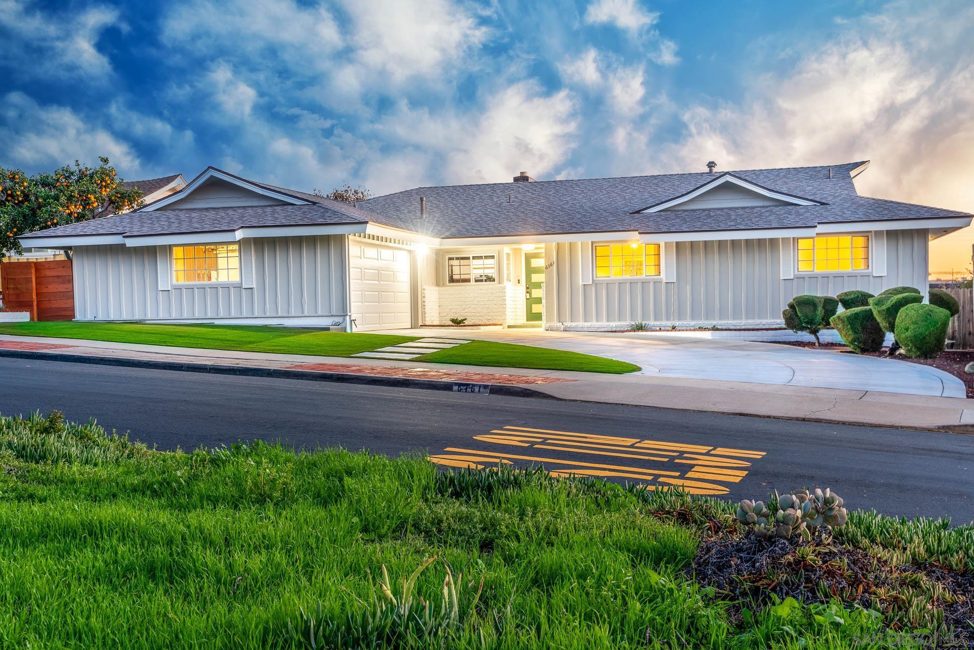 6161 Del Cerro Boulevard San Diego, CA 92120 - Photo 1 of 31 a front view of a house with a yard and potted plants