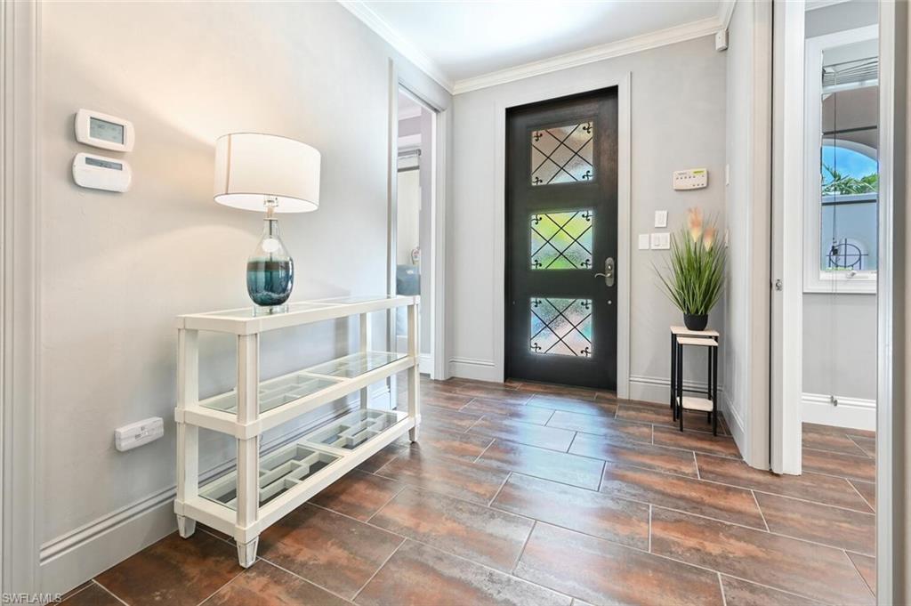 433 5th Street South Naples, FL 34102 - Photo 2 of 39 a view of an entryway with wooden floor and a livingroom