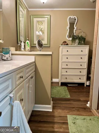 a bathroom with a sink a mirror and vanity