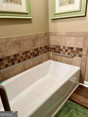 a white bath tub sitting in a bathroom