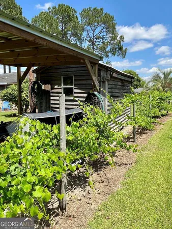 a backyard of a house with lots of green space