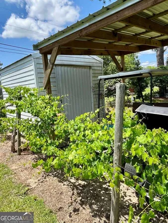 a view of a back yard of the house
