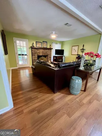 a kitchen with stainless steel appliances a refrigerator sink and microwave