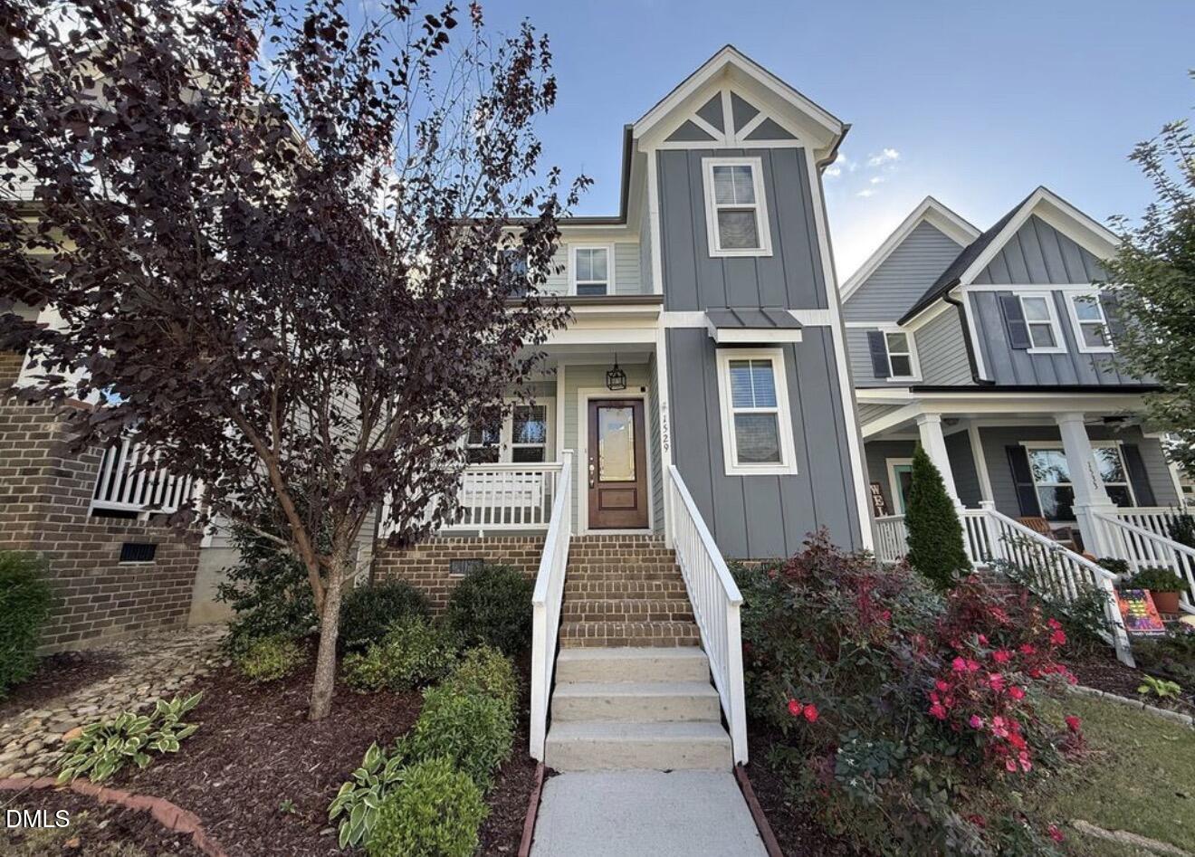 1529 Rhodeschool Drive Wendell, NC 27591 - Photo 1 of 36 a front view of a house with a garden