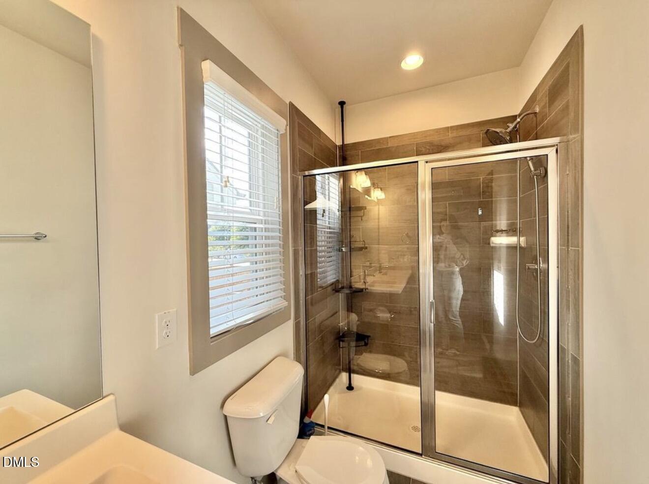 1529 Rhodeschool Drive Wendell, NC 27591 - Photo 13 of 36 a bathroom with a toilet and shower