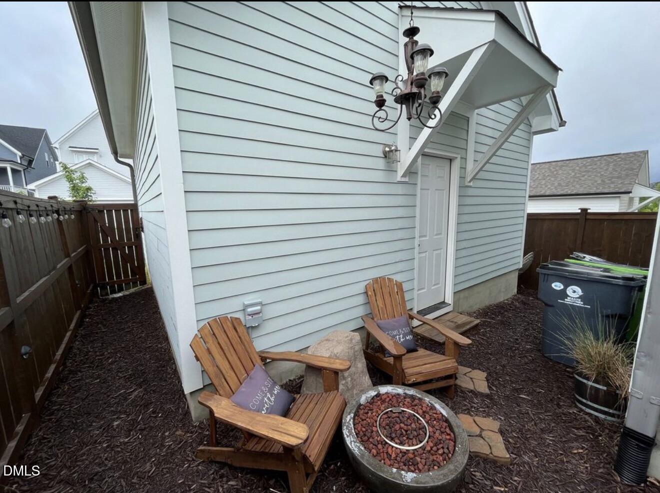 1529 Rhodeschool Drive Wendell, NC 27591 - Photo 24 of 36 a backyard of a house with fire pit and outdoor seating