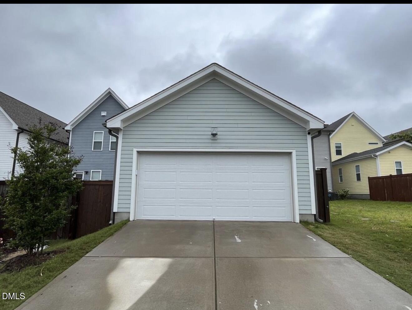 1529 Rhodeschool Drive Wendell, NC 27591 - Photo 27 of 36 a front view of house with garage and yard