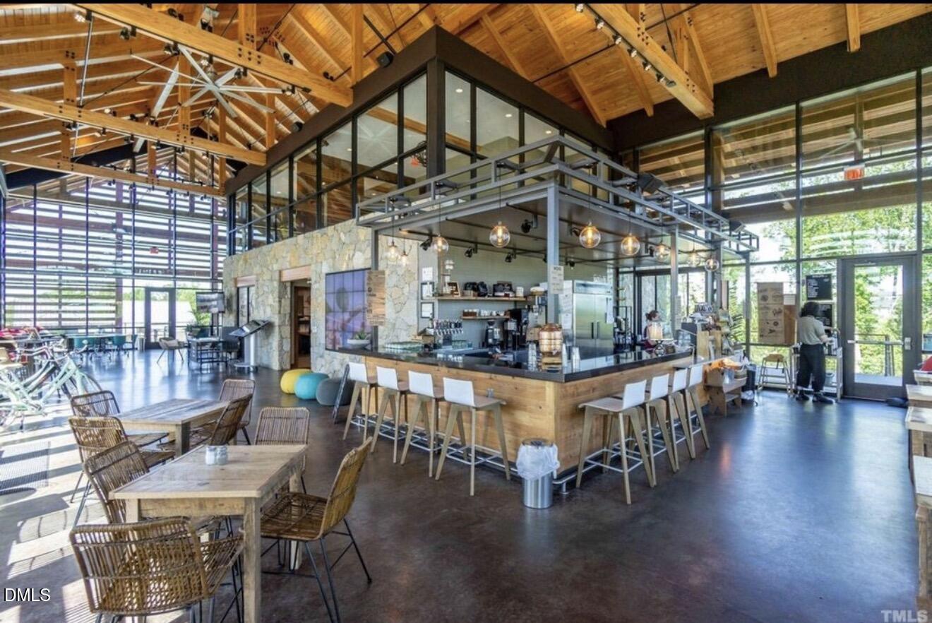 1529 Rhodeschool Drive Wendell, NC 27591 - Photo 32 of 36 a view of a dining room with furniture window and wooden floor