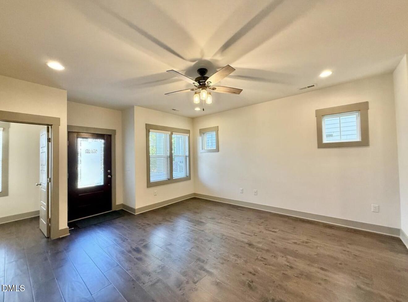 1529 Rhodeschool Drive Wendell, NC 27591 - Photo 4 of 36 a view of an empty room with window and wooden floor
