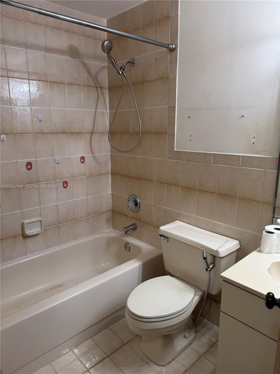 3262 Southwest 139th Place Miami, FL 33175 - Photo 12 of 36 a white toilet sitting next to a bath tub and shower