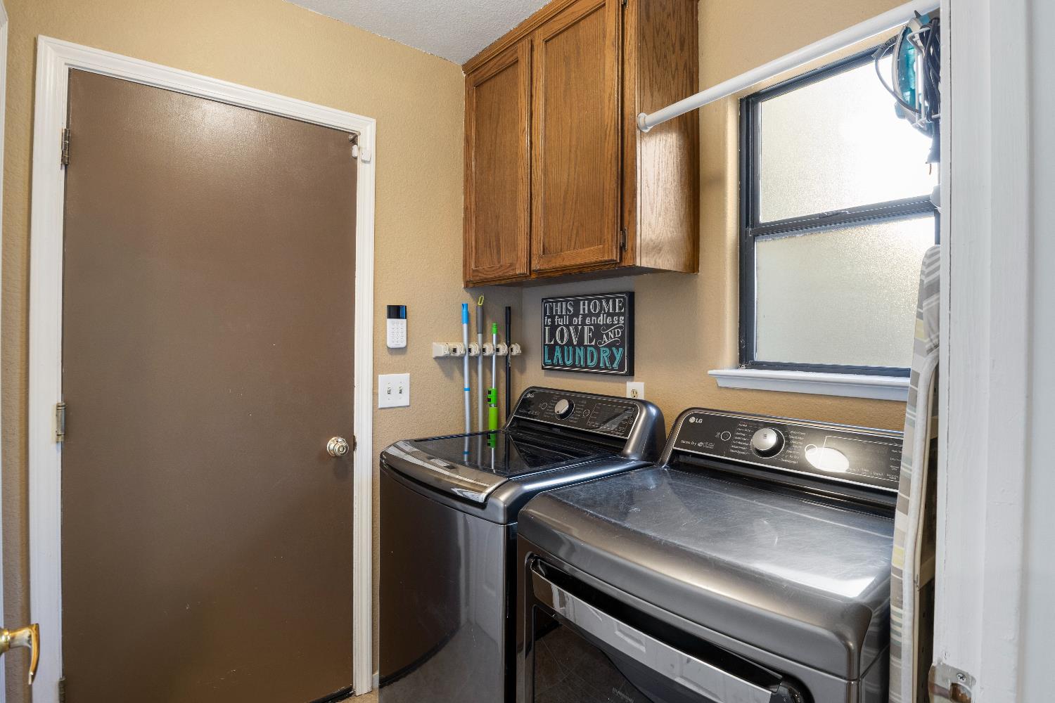 1057 Mission Ridge Drive Manteca, CA 95337 - Photo 26 of 49 Laundry room, cabinet and closet (not pictured) storage.