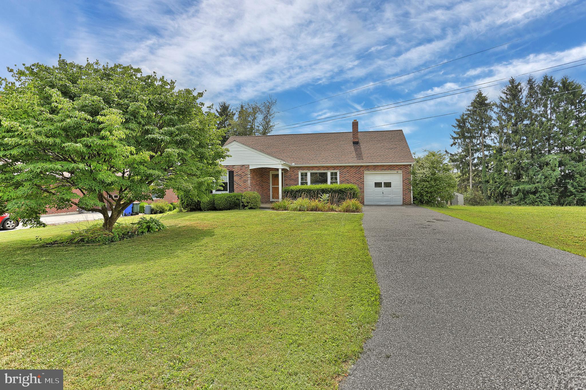 392 Waters Road York, PA 17403 - Photo 2 of 43 a front view of a house with garden