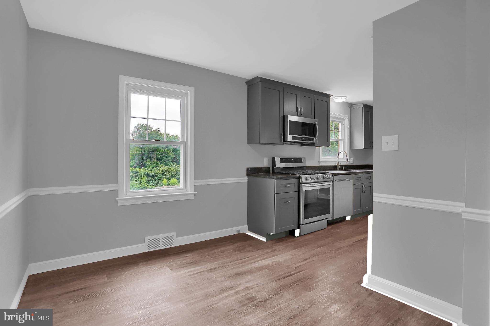 392 Waters Road York, PA 17403 - Photo 11 of 43 a kitchen with a sink and steel appliances