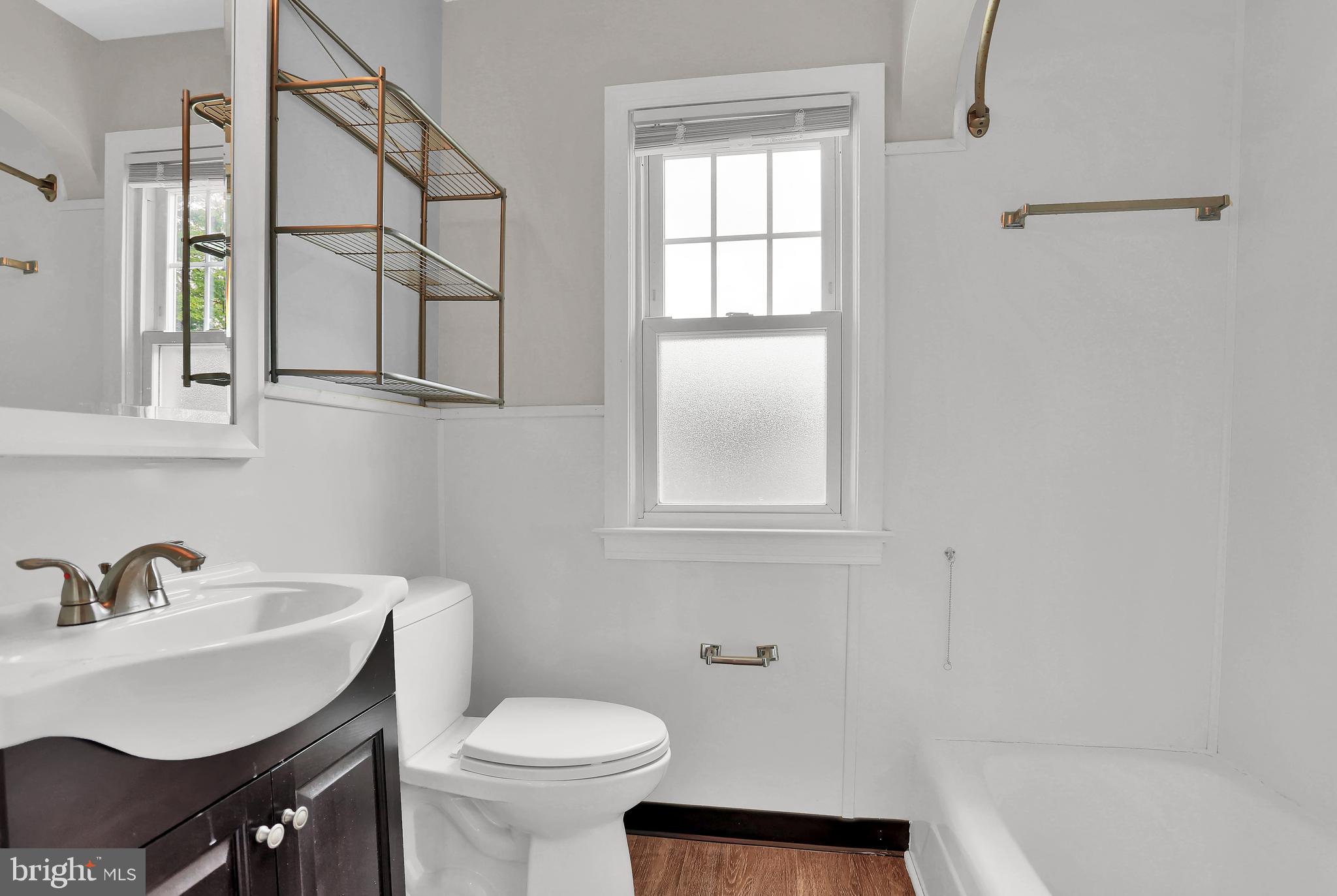 392 Waters Road York, PA 17403 - Photo 21 of 43 a bathroom with a sink toilet a mirror and shower
