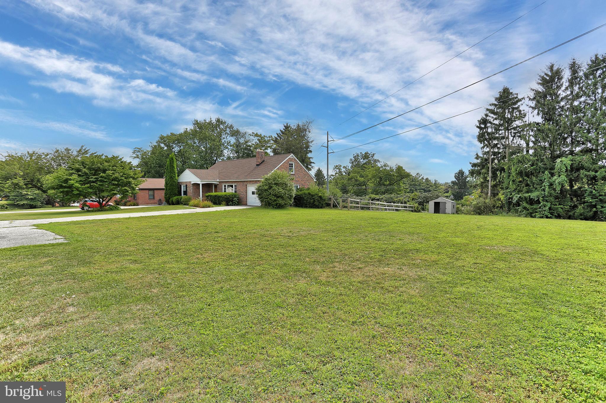 392 Waters Road York, PA 17403 - Photo 42 of 43 a view of a green field with house in the background