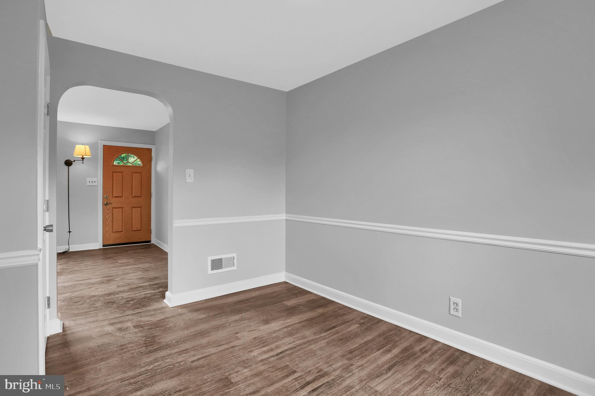 392 Waters Road York, PA 17403 - Photo 8 of 43 a view of an empty room with wooden floor and a window