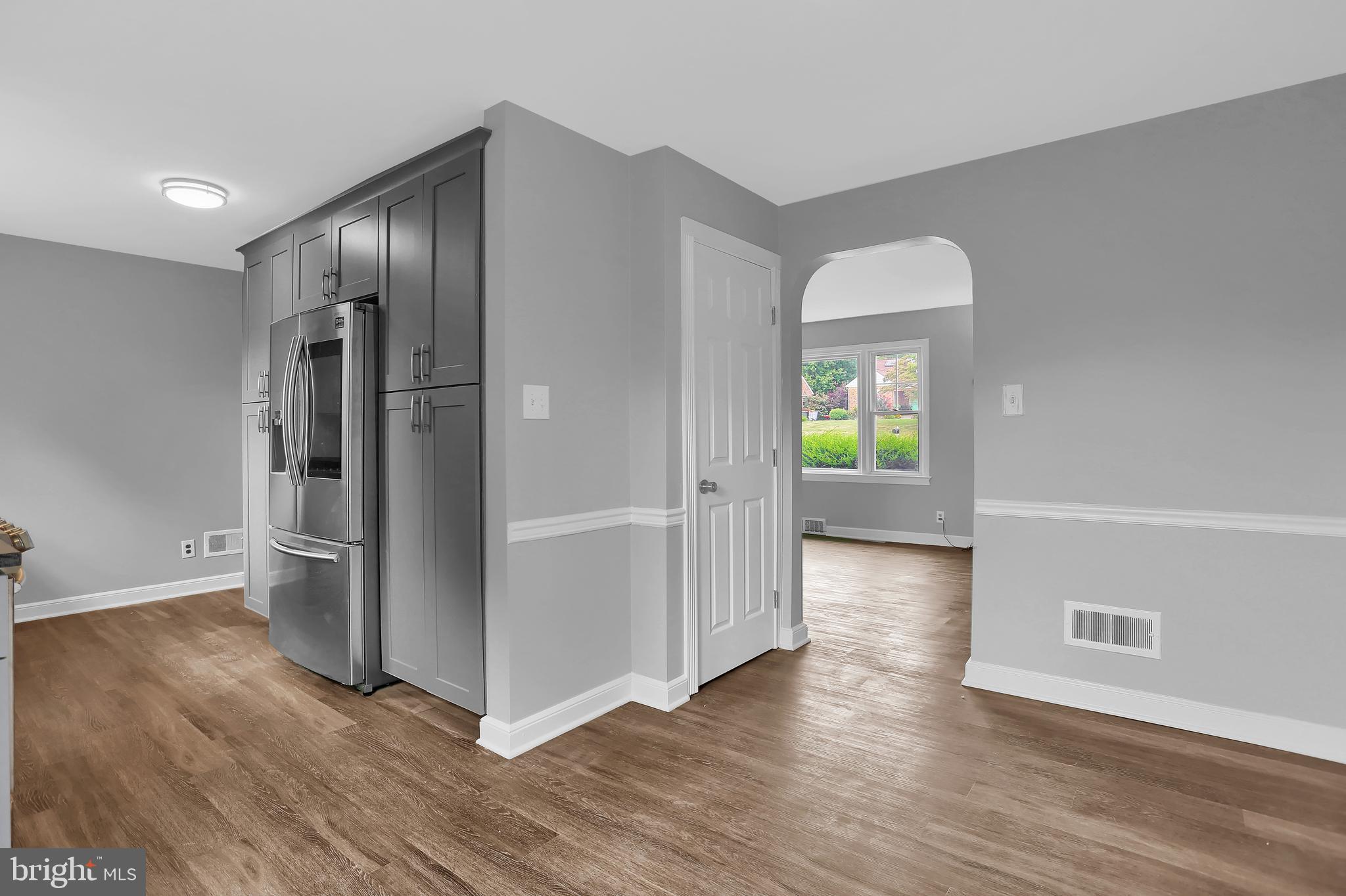 392 Waters Road York, PA 17403 - Photo 9 of 43 a view of an empty room with wooden floor and a window