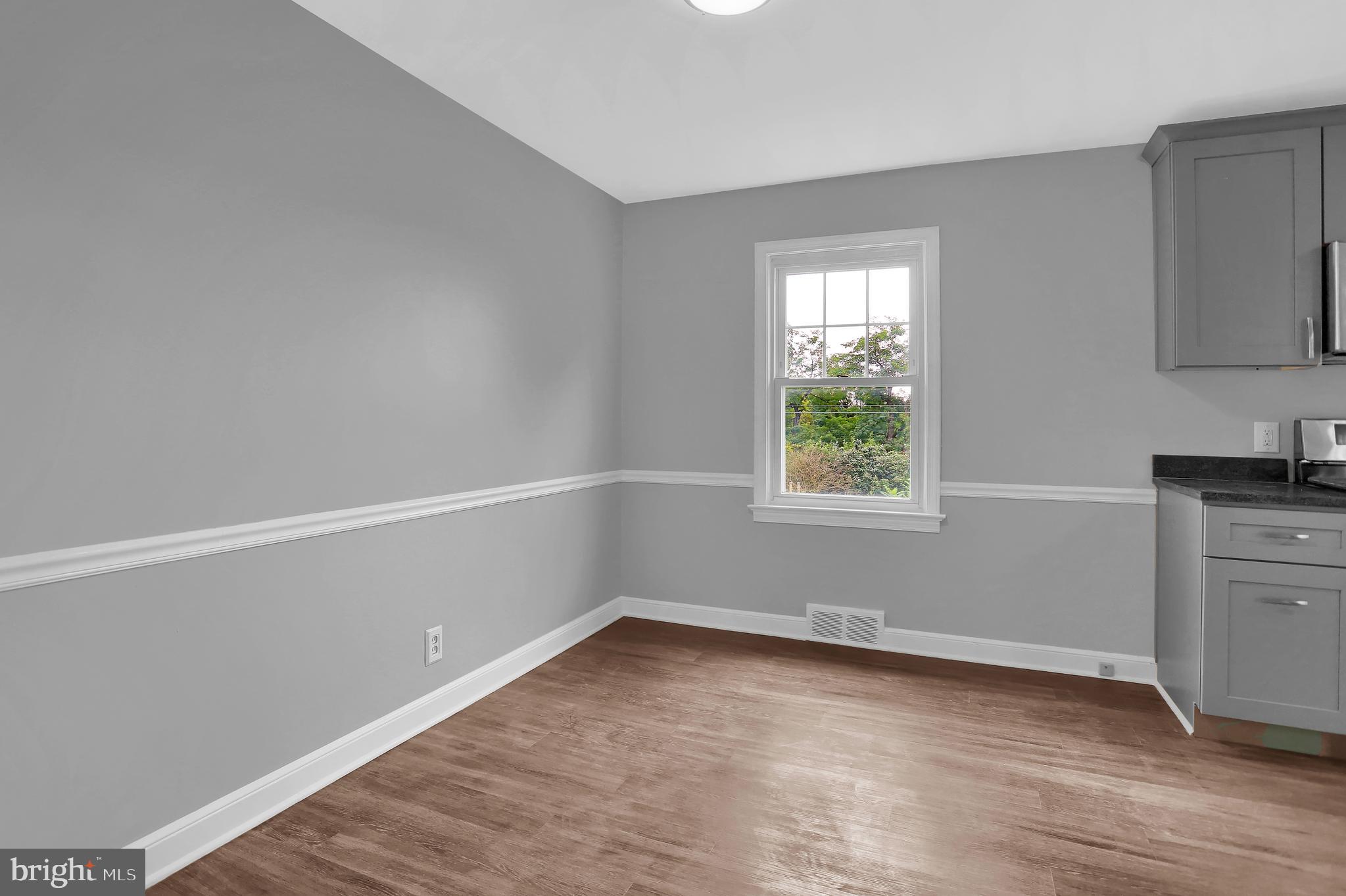 392 Waters Road York, PA 17403 - Photo 10 of 43 wooden floor in an empty room with a window
