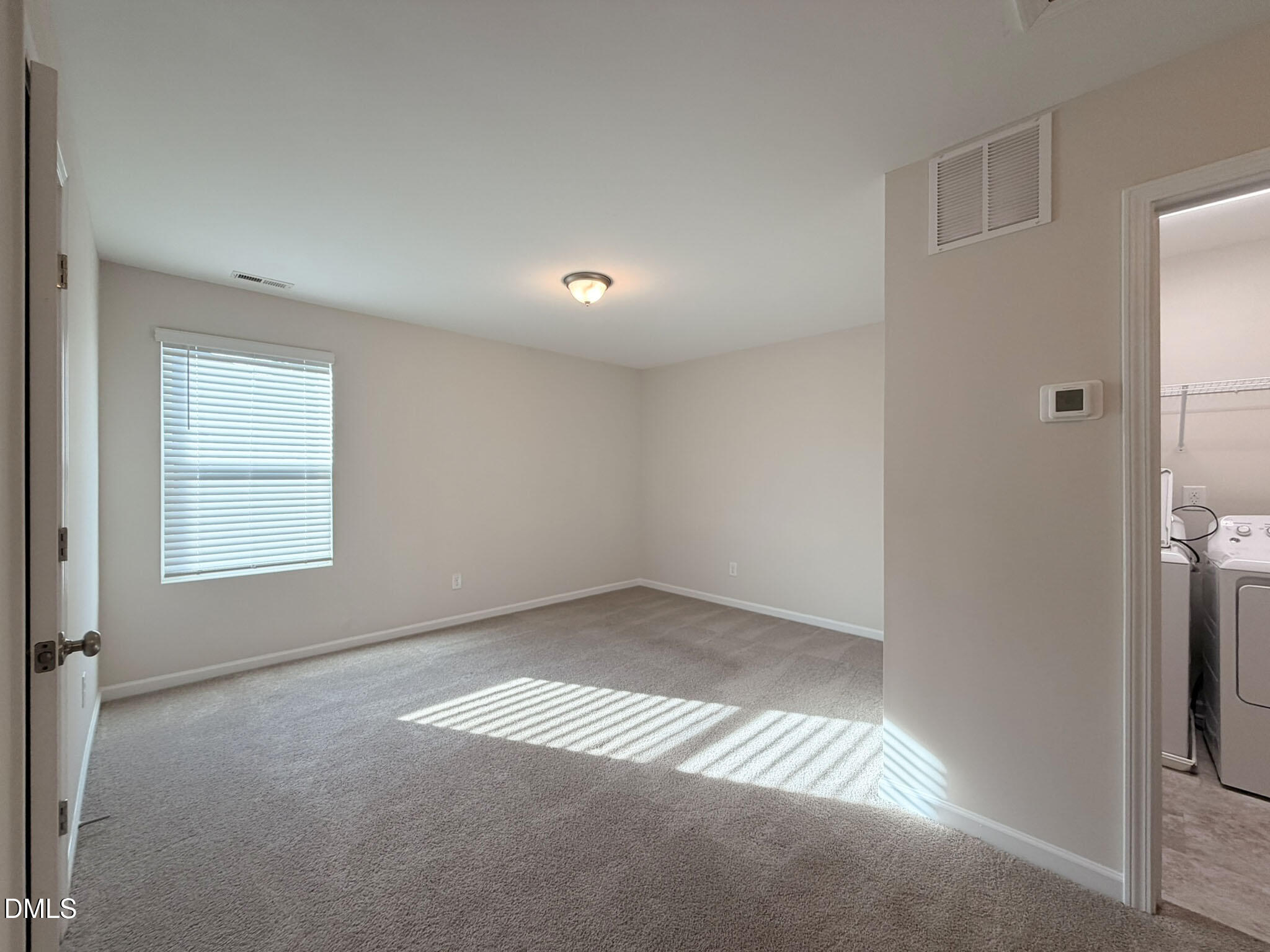 2801 Killian Court Raleigh, NC 27610 - Photo 11 of 26 an empty room with windows