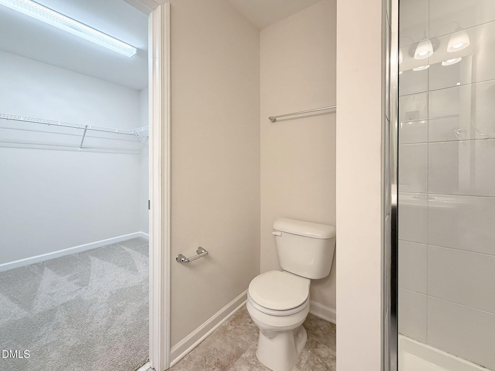 2801 Killian Court Raleigh, NC 27610 - Photo 22 of 26 a bathroom with a toilet and a shower