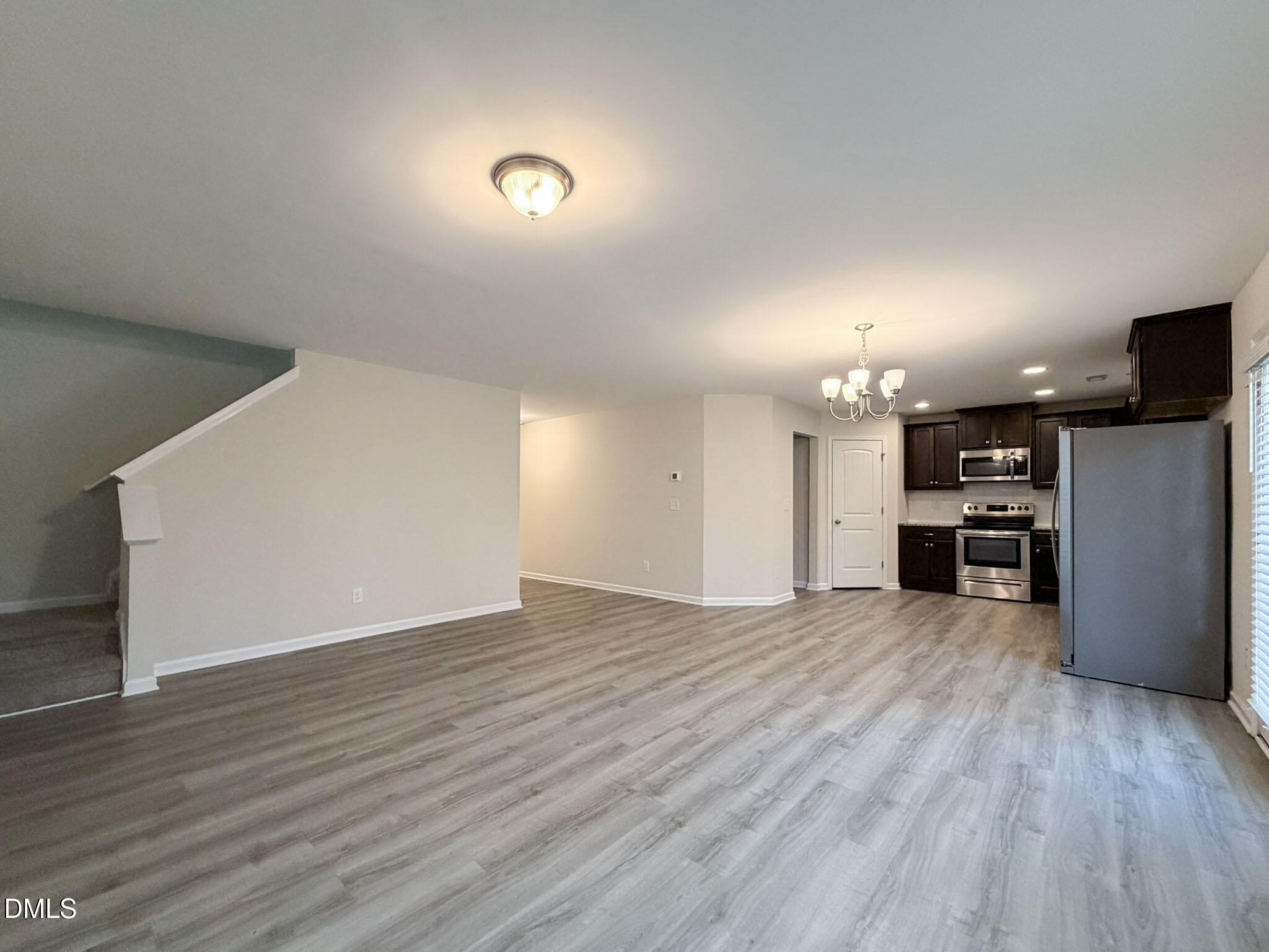 2801 Killian Court Raleigh, NC 27610 - Photo 6 of 26 a view of a kitchen with a sink and a stove top oven