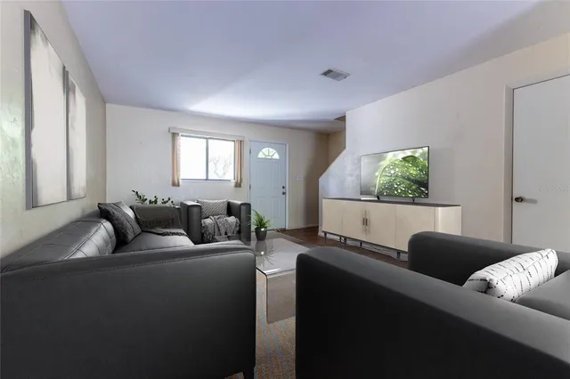a living room with furniture and a window