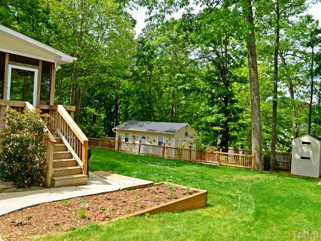 7413 Mine Shaft Road Raleigh, NC 27615 - Photo 3 of 19 a view of a house with backyard and deck