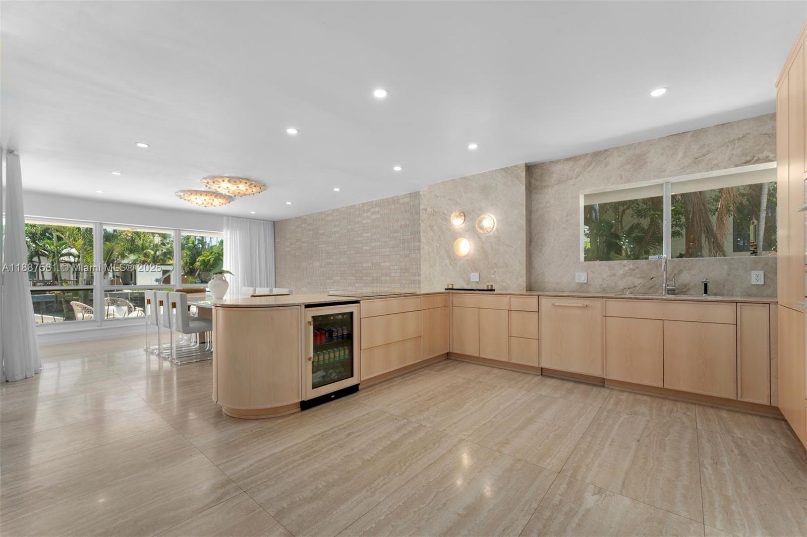 1250 Northeast 87th Street Miami, FL 33138 - Photo 14 of 53 a large white kitchen with a large window
