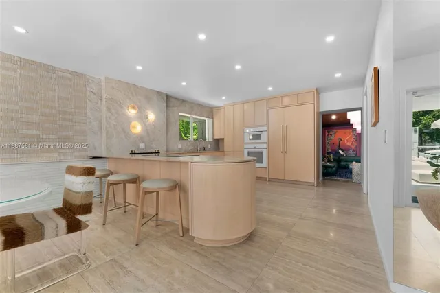 a kitchen with a sink and refrigerator