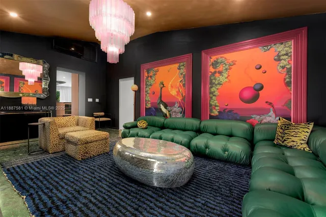 a spacious bedroom with a bed a couch and a large window