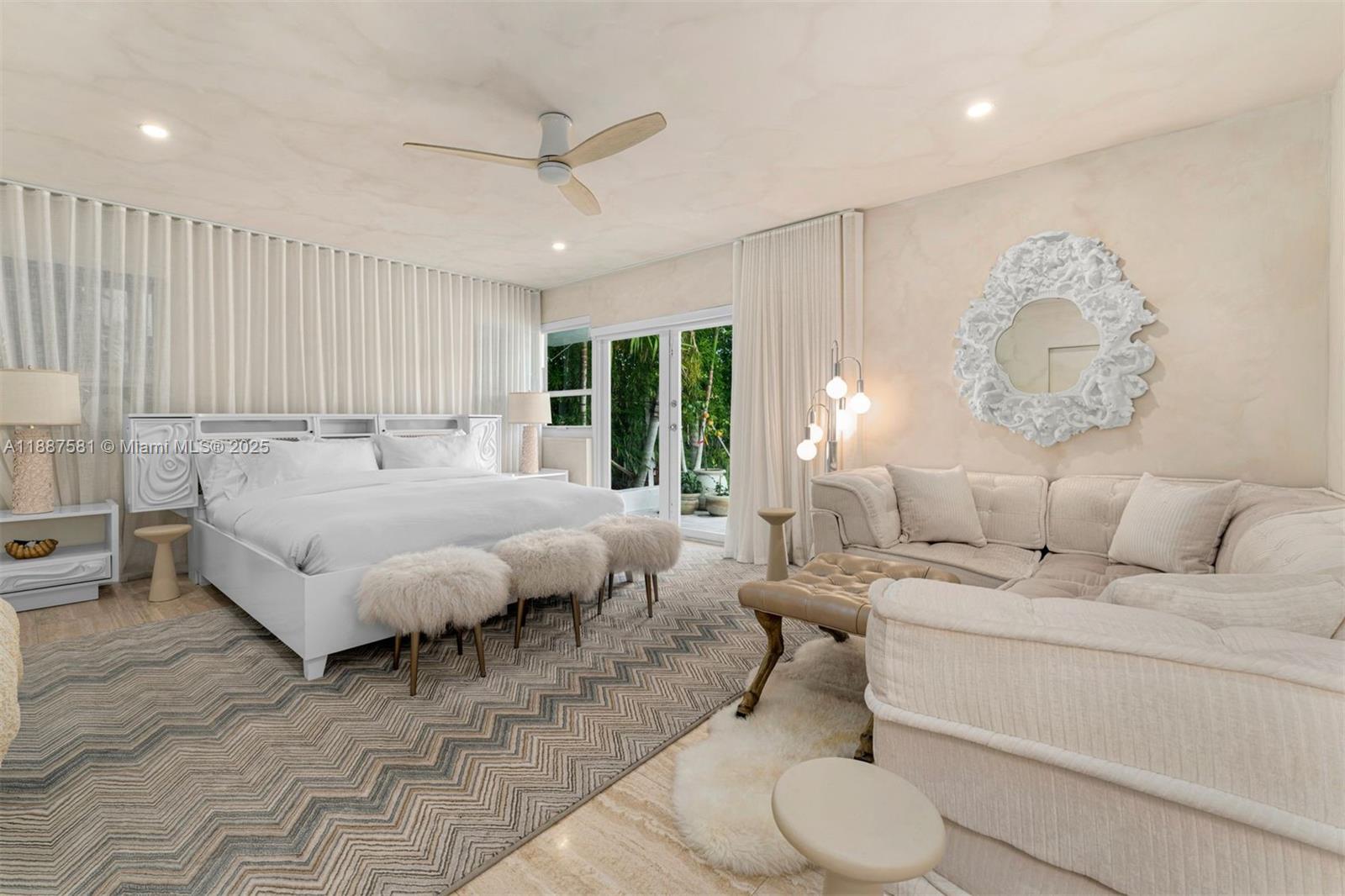 1250 Northeast 87th Street Miami, FL 33138 - Photo 20 of 53 a spacious bedroom with a bed a couch and a large window