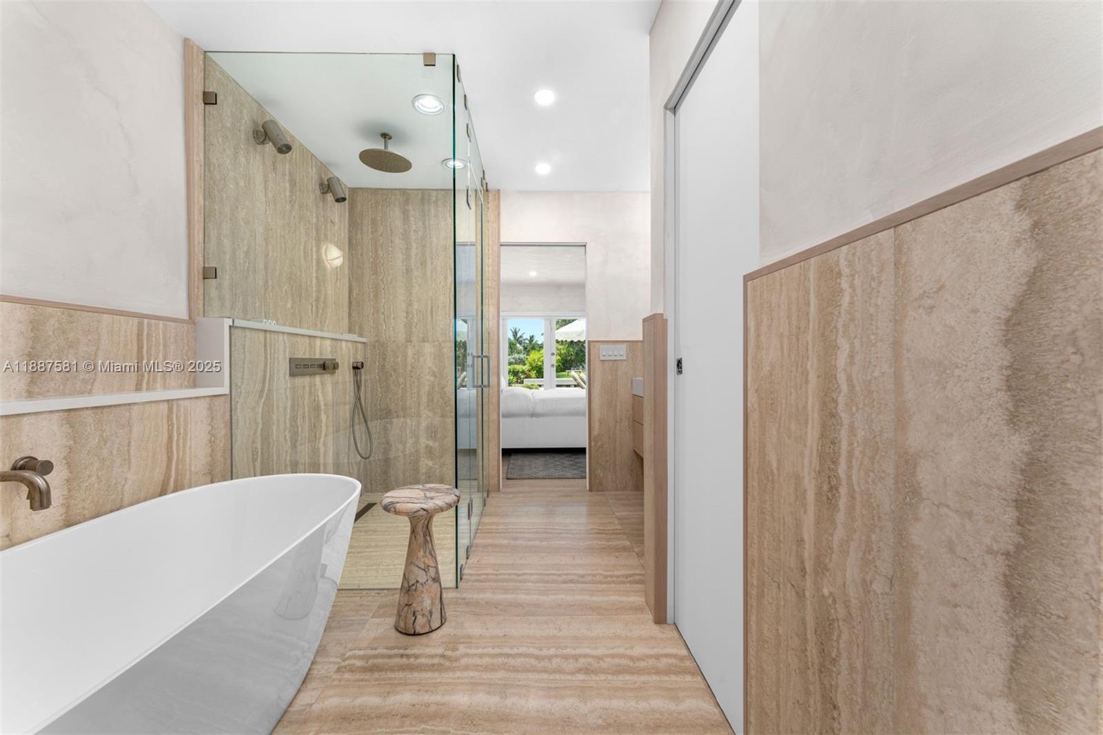 1250 Northeast 87th Street Miami, FL 33138 - Photo 23 of 53 a bathroom with a tub a sink and wooden floor