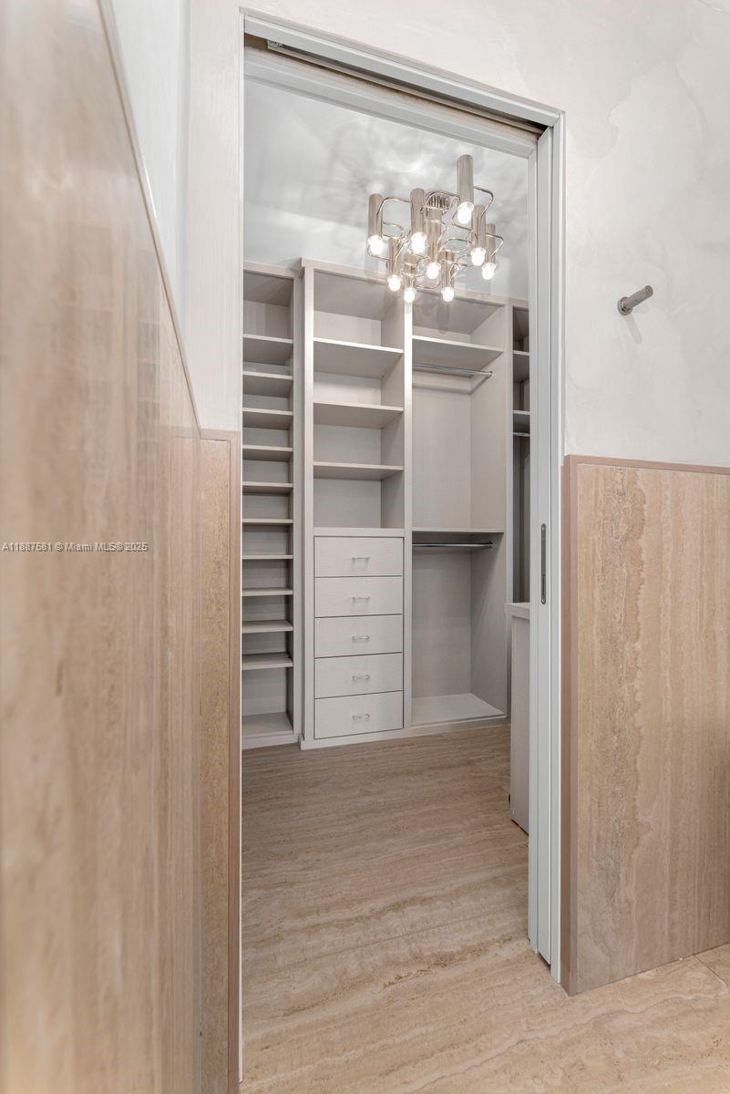 1250 Northeast 87th Street Miami, FL 33138 - Photo 24 of 53 a view of walk in closet with empty racks