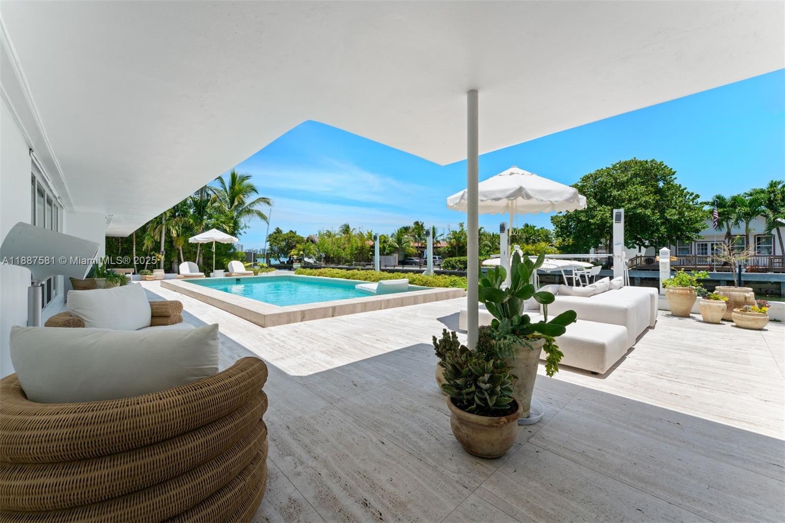 1250 Northeast 87th Street Miami, FL 33138 - Photo 31 of 53 a living room with furniture and a floor to ceiling window