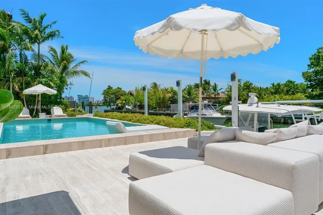 a view of a backyard with sitting area