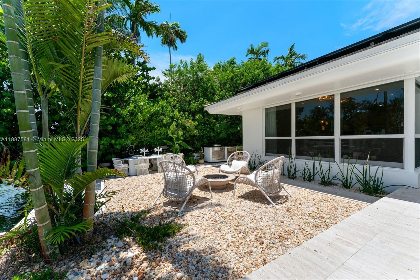 1250 Northeast 87th Street Miami, FL 33138 - Photo 34 of 53 a view of backyard with outdoor seating and plants