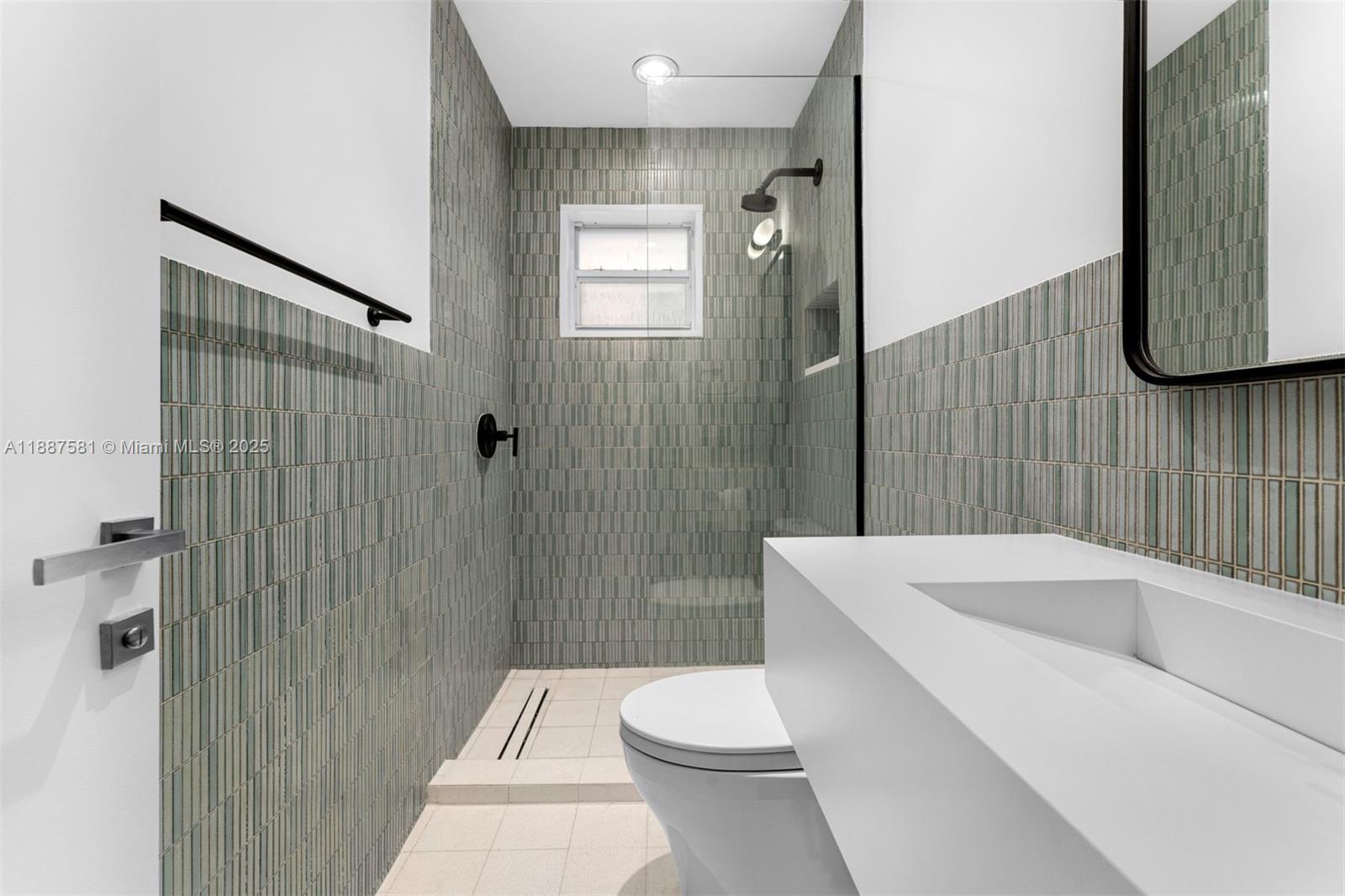 1250 Northeast 87th Street Miami, FL 33138 - Photo 41 of 53 a bathroom with a sink a toilet and shower