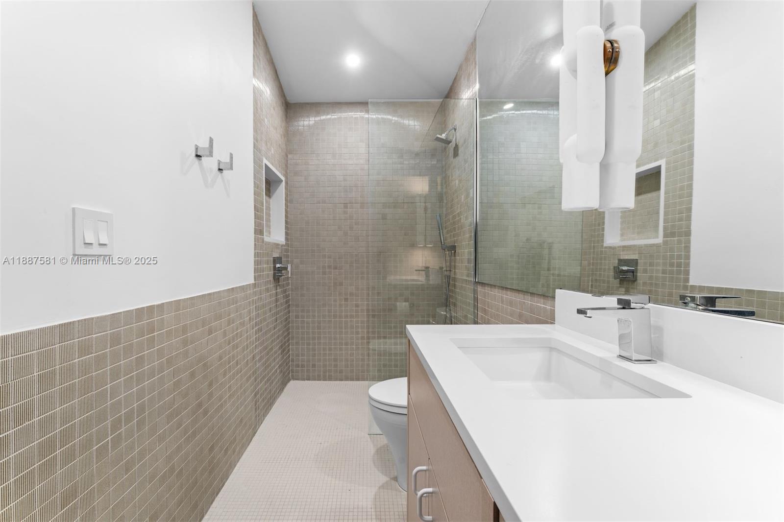 1250 Northeast 87th Street Miami, FL 33138 - Photo 44 of 53 a bathroom with a sink a toilet and shower